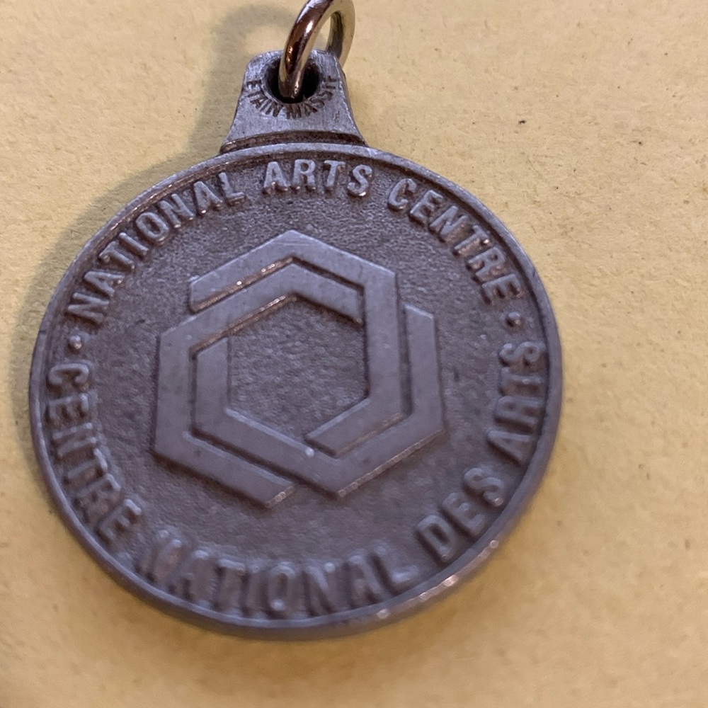 Medallion pendant National Arts Centre, reads Ottawa, Canada on back
